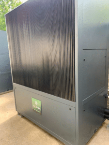 Clade Engineering's Acer 65/50 CO2 Heat Pump installed at Ruskin School, showcasing its innovative design for sustainable heating solutions